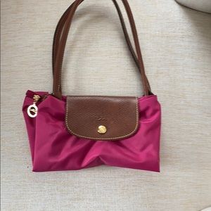 Small size pink Longchamp Le Pilage Tote.